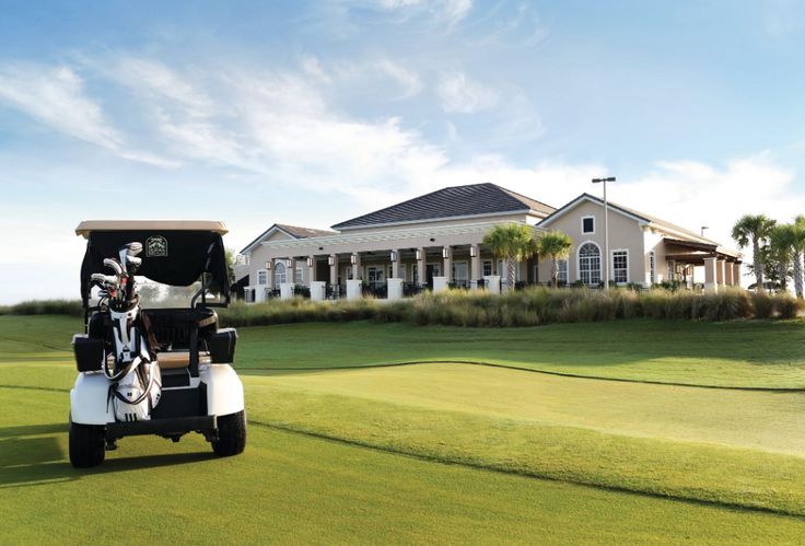 a golf cart parked in front of a large house