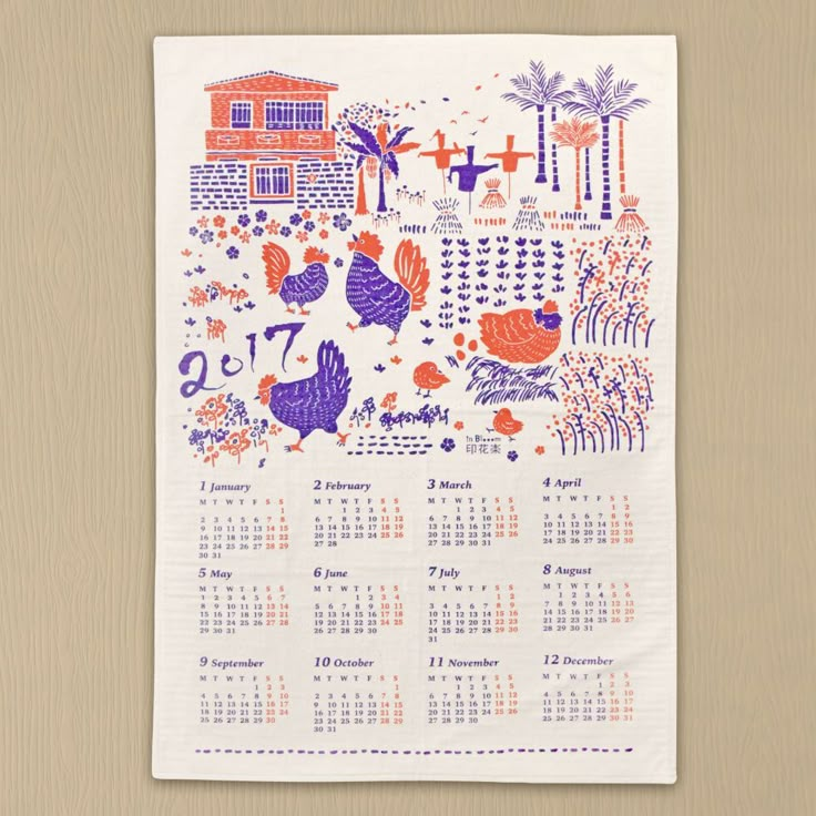 a calendar printed on a white napkin with orange and purple designs in the background,