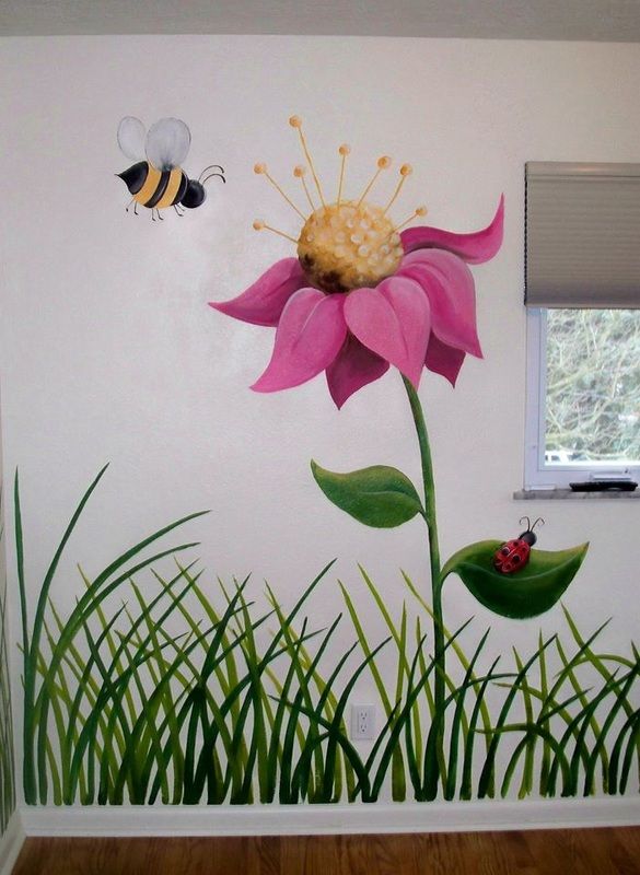 a wall painted with flowers and two bees on the top of it, in front of a window