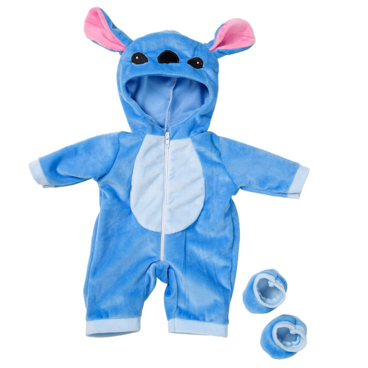 a blue and white baby's costume with ears on it, next to two pacifiers