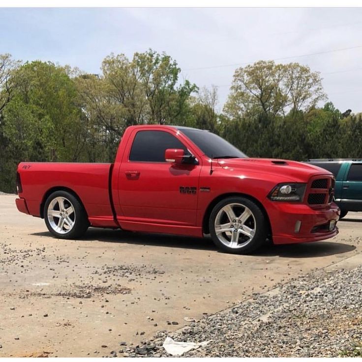 a red truck parked in a parking lot