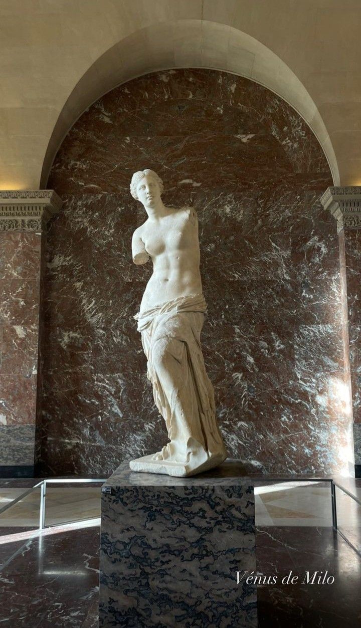 a marble statue in the middle of a room