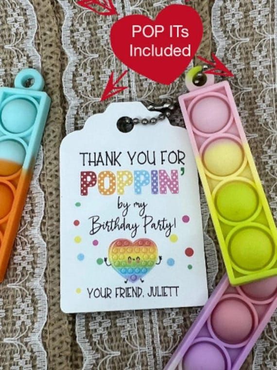 some colorful items are laying out on a table with a tag that says thank you for poppin by my birthday party