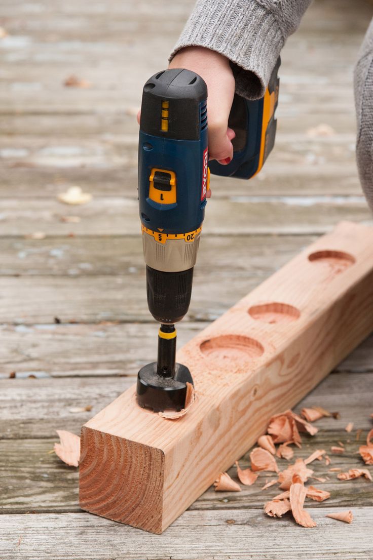 a driller being used on a piece of wood