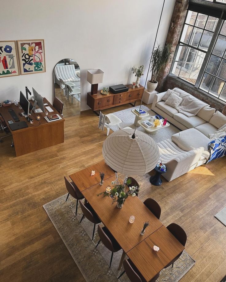 an aerial view of a living room and dining area