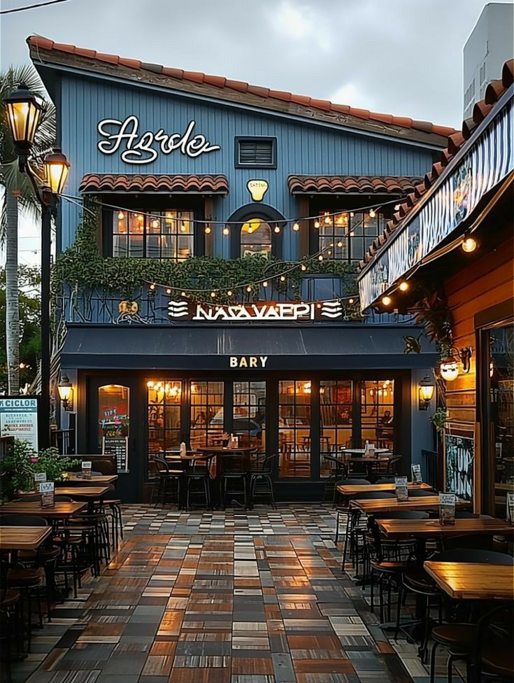 an outside view of a restaurant with tables and chairs