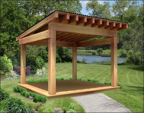 a wooden gazebo sitting on top of a lush green field