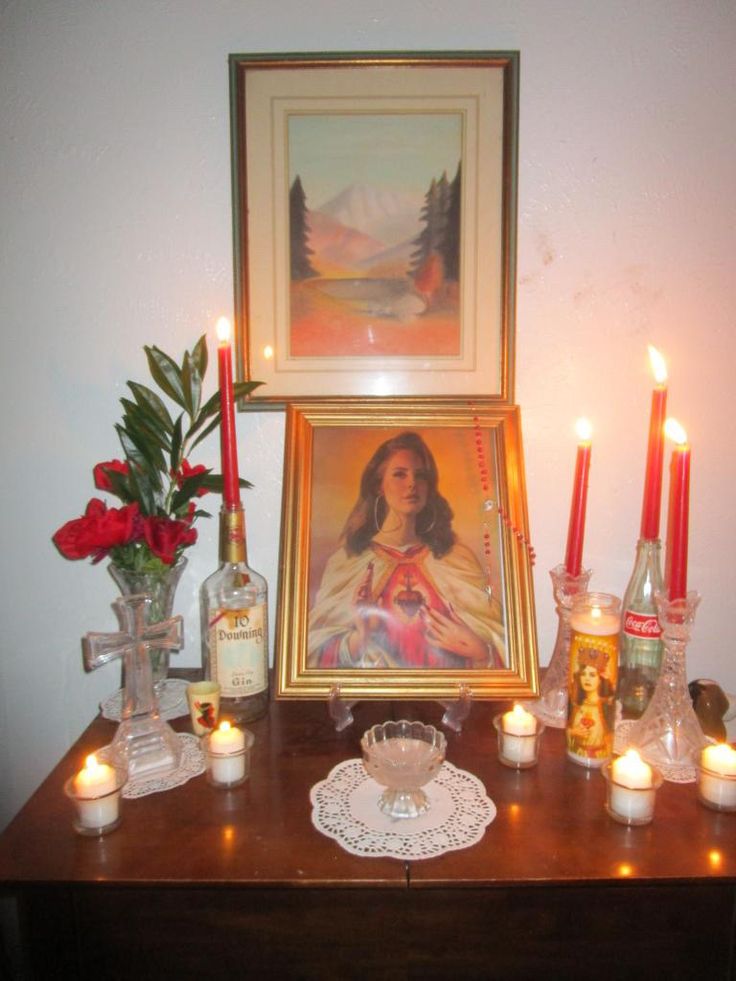 a table with candles and pictures on it