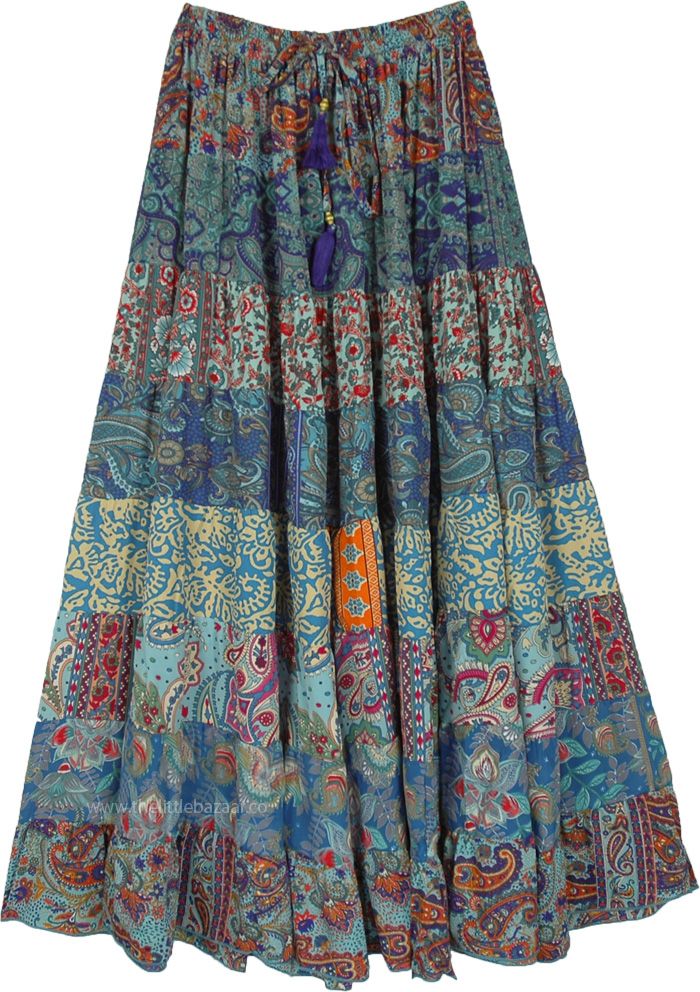 A beautiful multi-panel long skirt with a good fall and floral blue prints. The skirt has an elastic waist with a tassel drawstring. #tlb #Patchwork #MaxiSkirt #Printed #TieredSkirt #Summerskirt Blue Patchwork Maxi Skirt For Spring, Hippie Blue Long Skirt, Blue Flowy Maxi Skirt For Festivals, Blue Hippie Long Skirt, Blue Floral Print Bottoms For Festival, Festival Blue Lined Maxi Skirt, Blue Bohemian Long Skirt, Bohemian Skirt With Tassels, Blue Long Patchwork Skirt