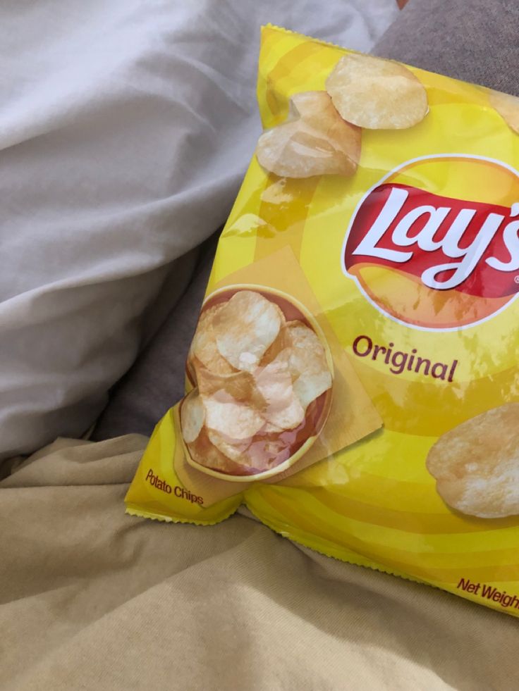 lays original potato chips on a bed