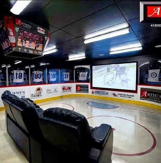 an ice hockey rink with chairs and televisions