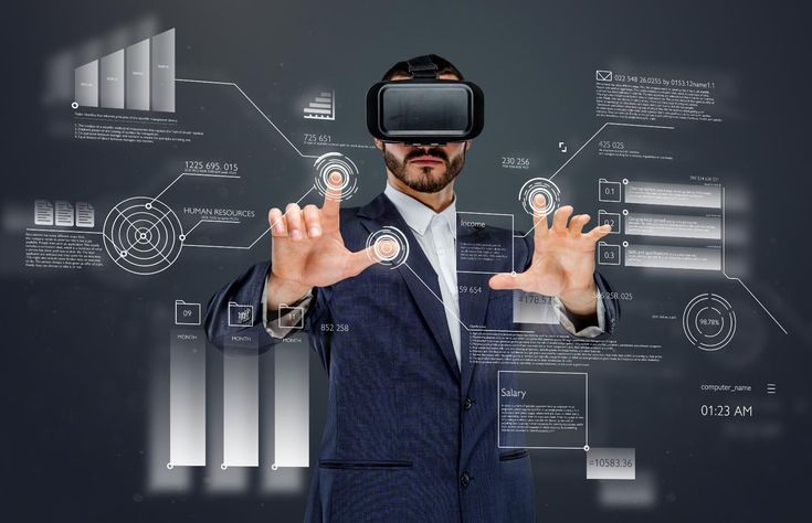 a man wearing a suit and holding out his hands with virtual reality on the screen