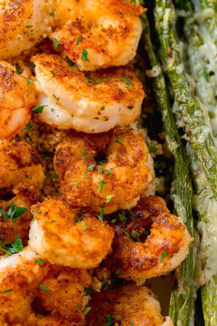 cooked shrimp and asparagus on a plate