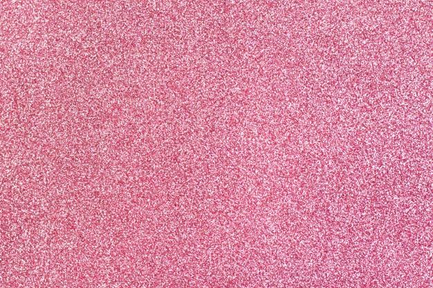 pink glitter textured paper with white background