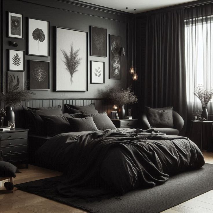 a bedroom with black walls and pictures on the wall above the bed, along with other furniture