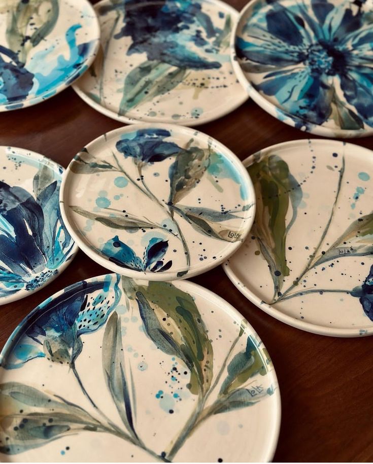 several plates with blue flowers painted on them