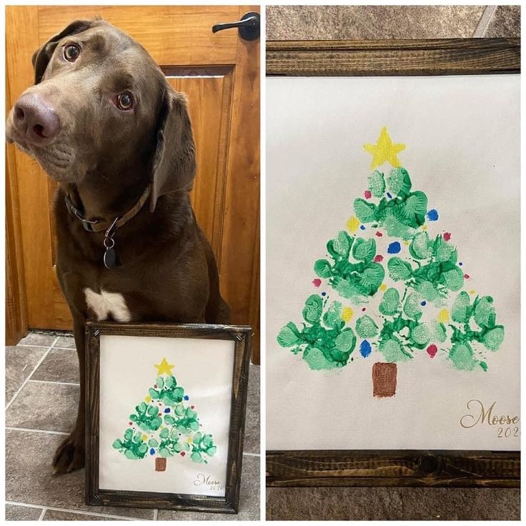 a brown dog sitting next to a christmas tree with handprints on the front