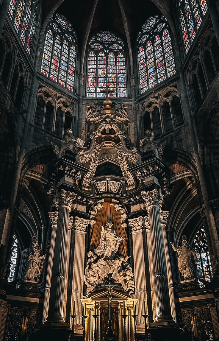 the interior of a cathedral with stained glass windows