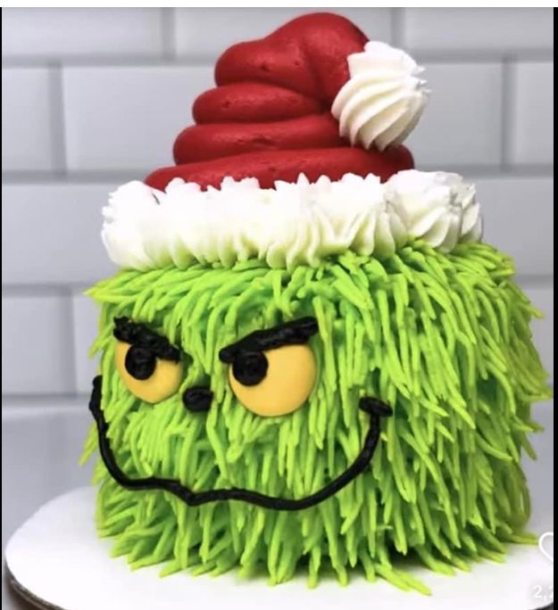 there is a cake made to look like a green monster