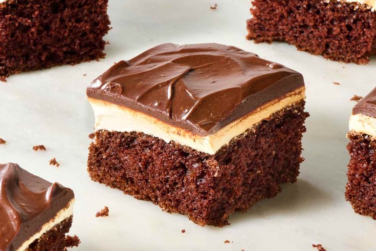 several pieces of chocolate cake with frosting on top