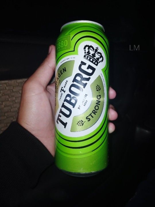 a person holding up a can of beer in their hand with the caption tipparrog on it