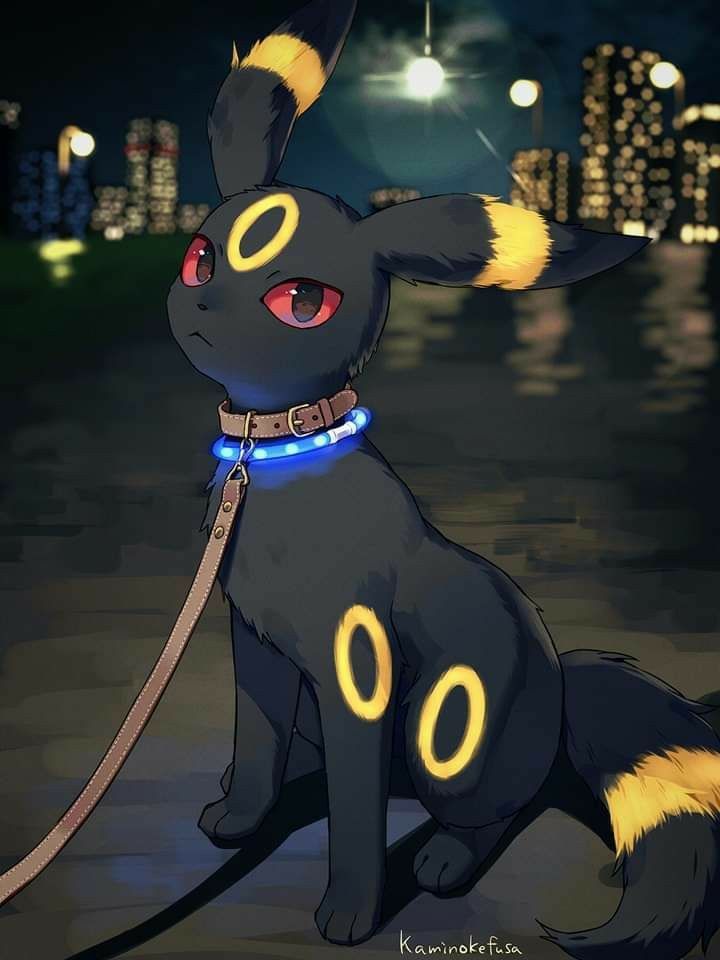 a black and yellow pokemon pikachu sitting on top of a sidewalk at night