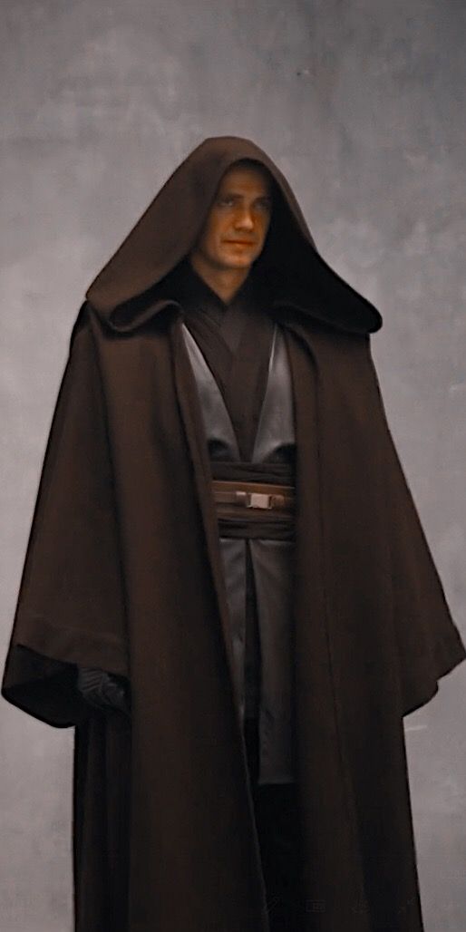 a man in a star wars costume standing with his hands on his hips