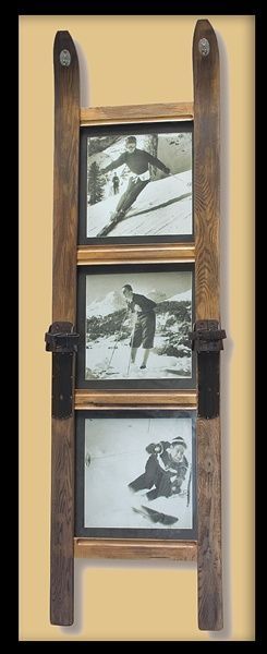 an old wooden ladder with three pictures hanging on it's sides and the bottom one is made out of wood