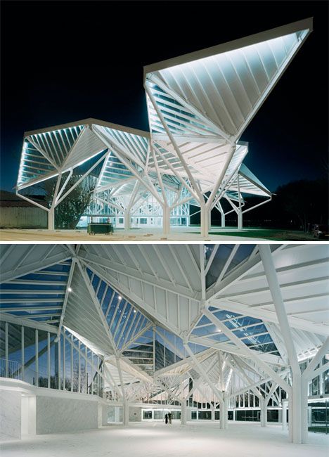 two pictures of the inside and outside of a building at night, one is lit up