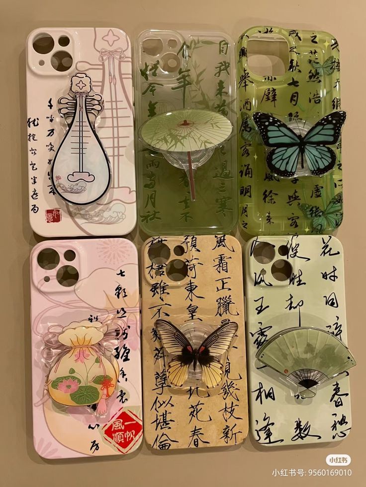 six cell phones with chinese writing and pictures on them, all in different shapes and sizes