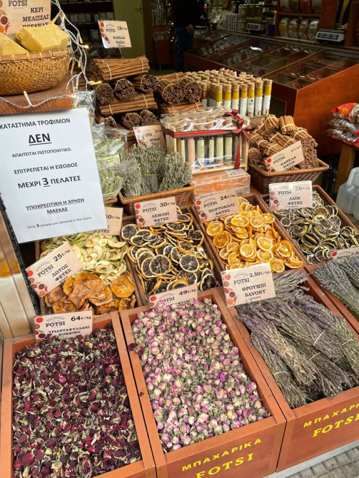 many different types of dried herbs on display