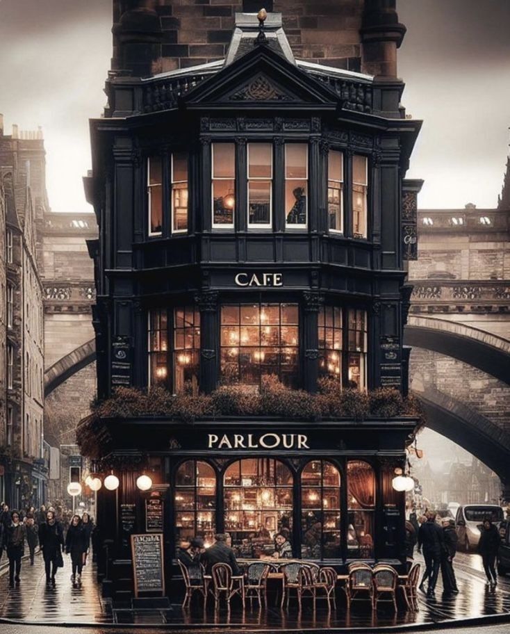 an image of people walking down the street in front of a cafe on a rainy day