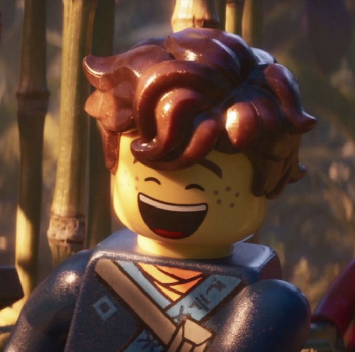 a close up of a lego character with an evil look on his face and hair