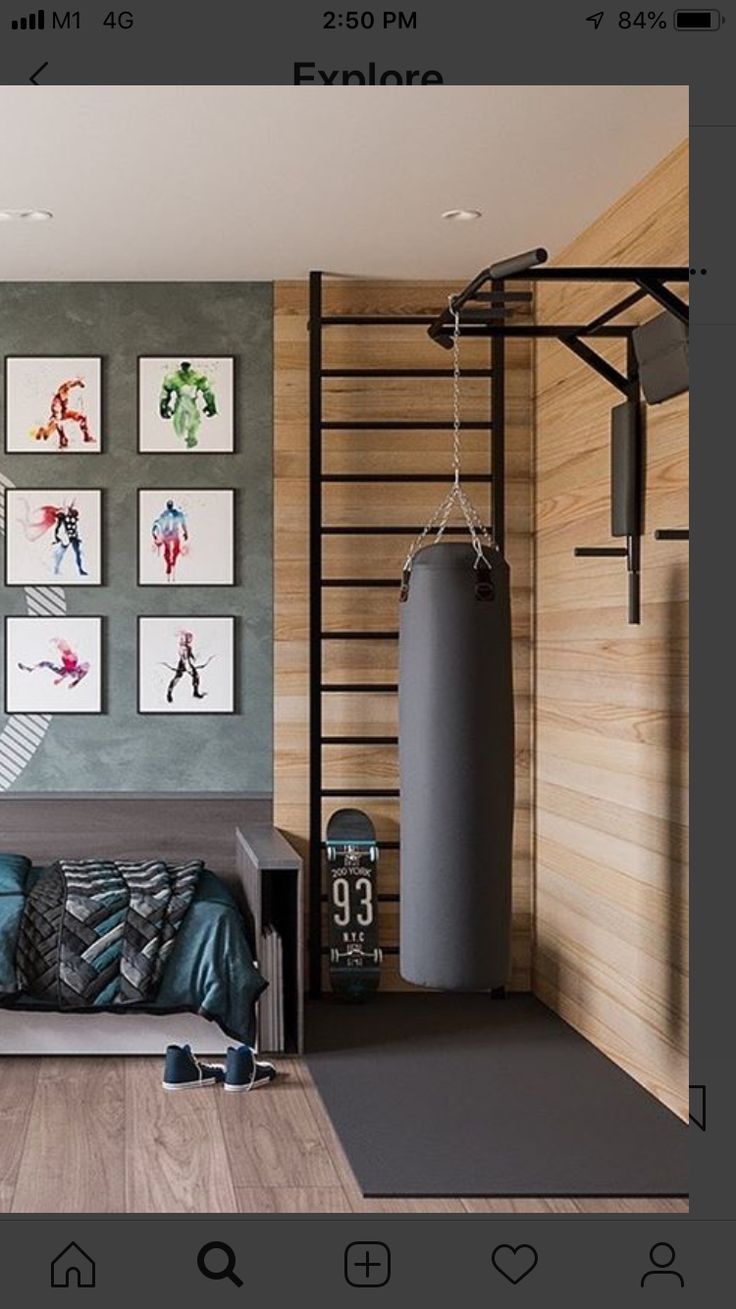 a living room filled with furniture and pictures on the wall next to a punching bag