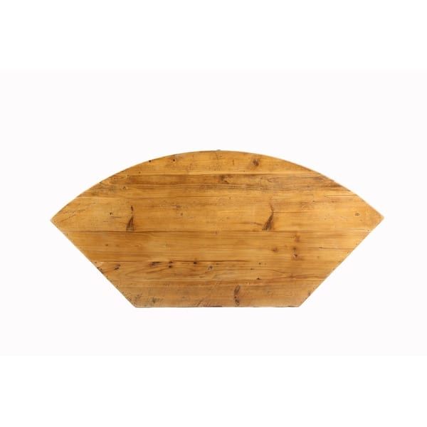 a wooden cutting board with an arrow shaped design on the top and bottom side, against a white background