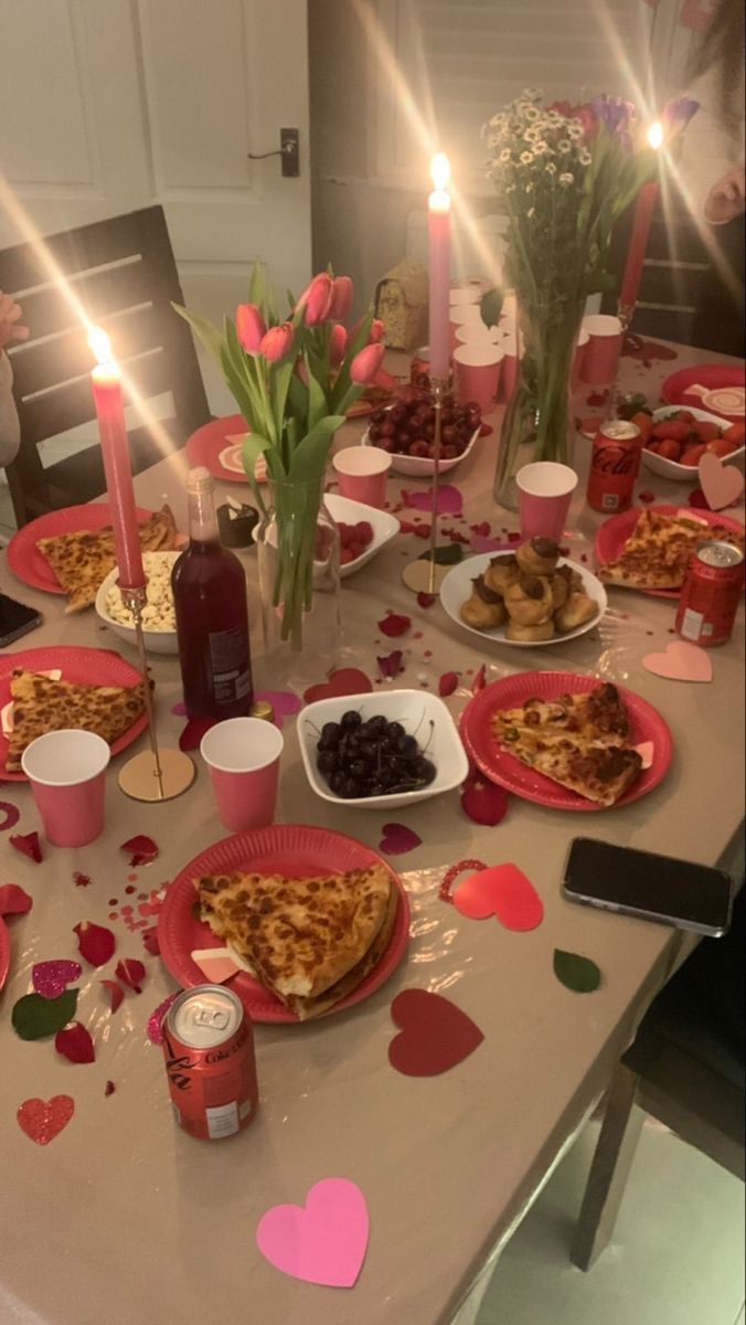 the table is set for valentine's day with heart shaped plates