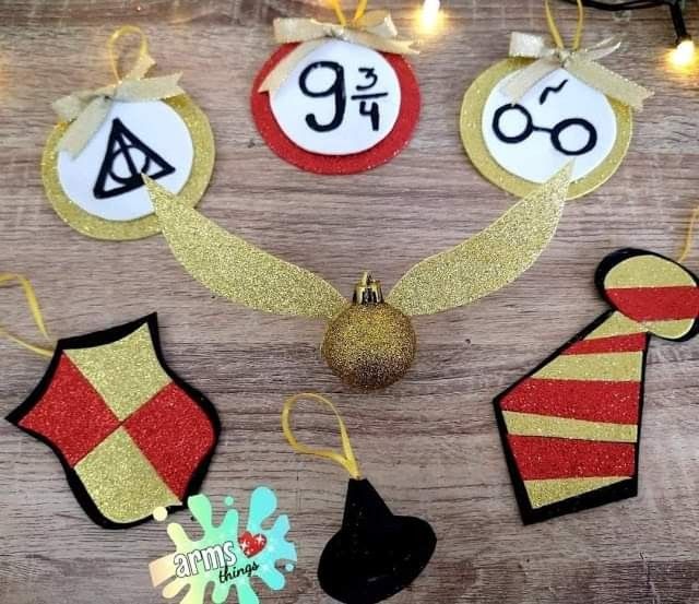 christmas ornaments are arranged on a wooden table