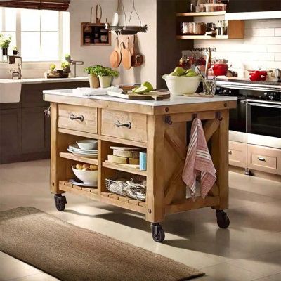 a kitchen island sitting in the middle of a room next to a stove top oven