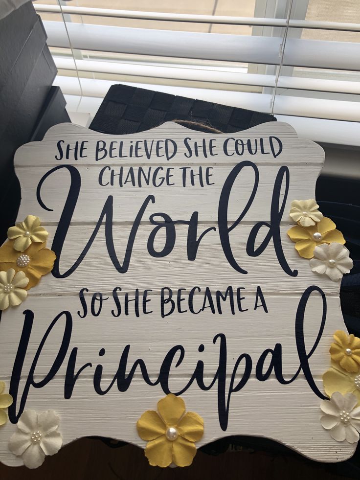 a sign that says she belved she could change the world so she become a principals