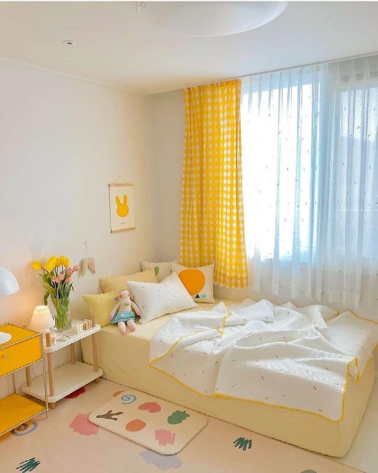 a bedroom with yellow curtains and white walls