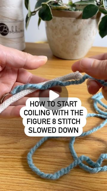 someone crocheting a piece of blue yarn with the words how to start coiling with the figure 8 stitch slowly down