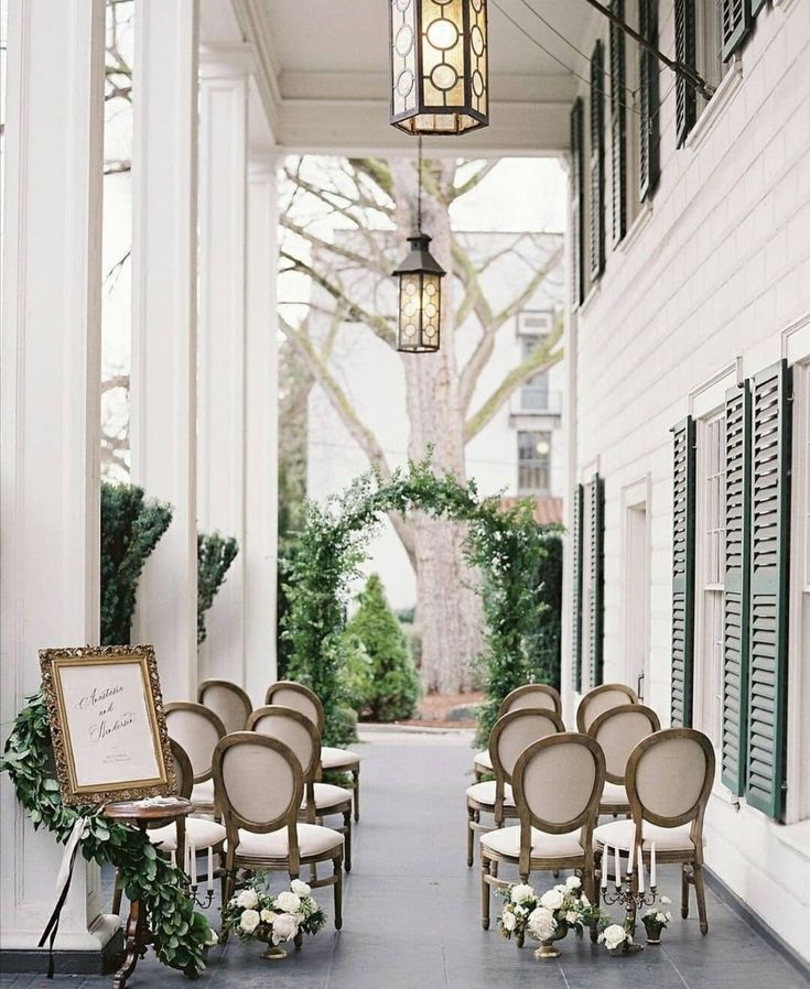 chairs are lined up on the front porch for an outdoor wedding ceremony in charleston, sc