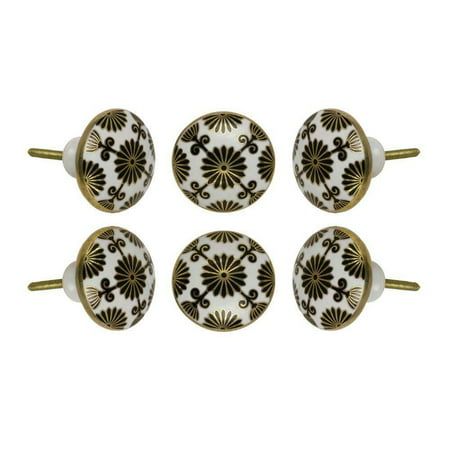 four black and white knobs with gold accents