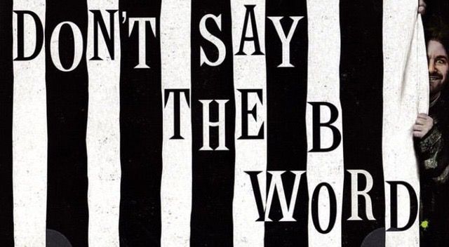 a man peeking out from behind a black and white striped curtain with the words, don't say the b word