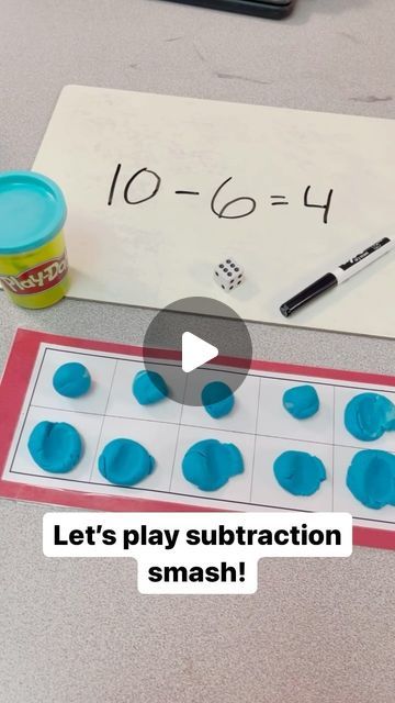 a video demonstrating subtraction with numbers and dices on the table next to it