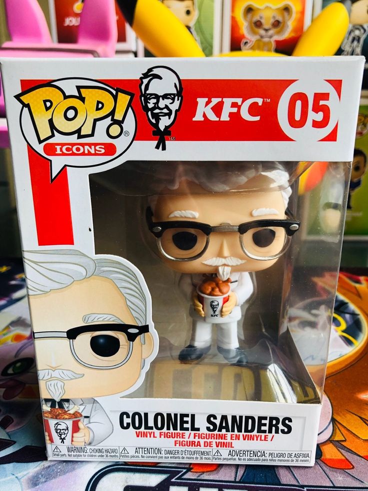 a pop vinyl figurine in a box with an image of colonel sanders on it