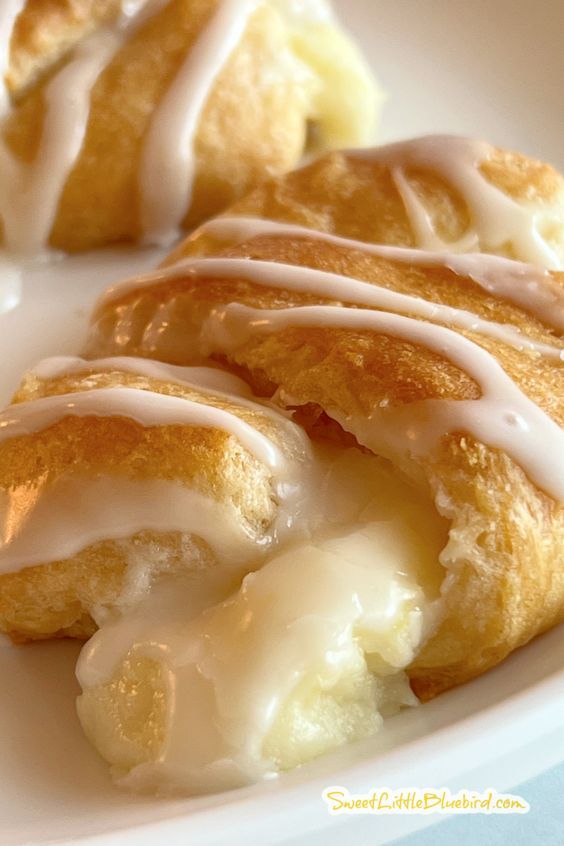 some kind of pastry with icing on a white plate