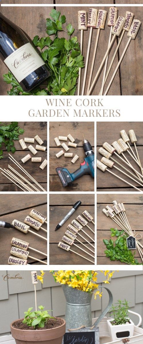 wine cork garden markers are displayed on a table with flowers and gardening tools next to them