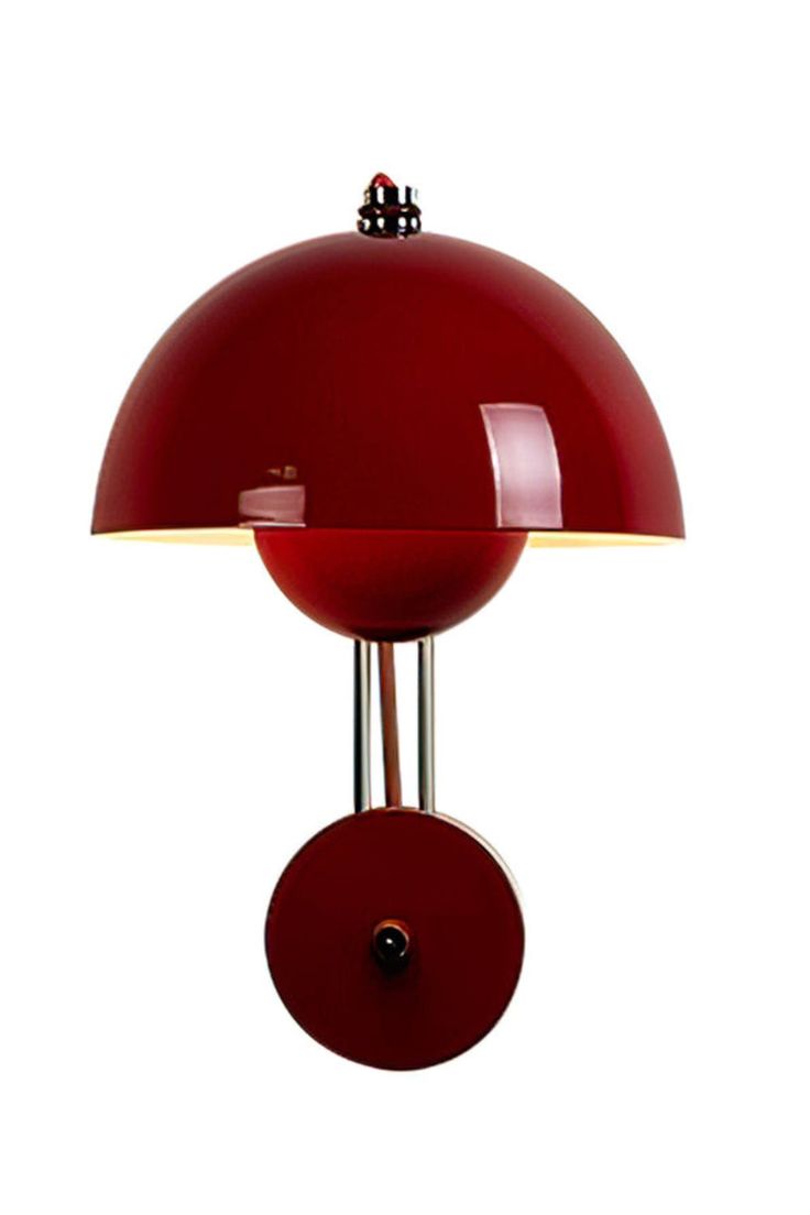 a red table lamp on a white background