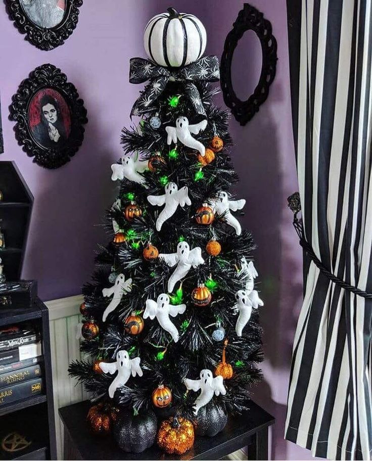 a decorated halloween tree in a living room